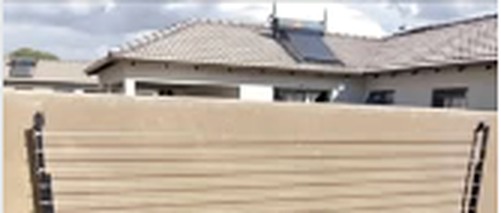 Washing line beside boundary screen